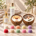 Coffret cadeau Luminante Éclat : un diffuseur d'ambiance et ses bâtonnets, un vaporisateur, deux bougies parfumées en noix de coco dont une allumée et dix fondants parfumés