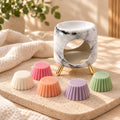 Coffret cadeau Luminante Escale sensorielle : un brûle-parfum en céramique effet marbre et cinq fondants parfumés de couleurs pastel