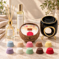 Coffret cadeau Luminante Grande Évasion : un diffuseur d'ambiance et ses bâtonnets, un vaporisateur, une bougie parfumée en noix de coco, un brûle-parfum noir et or et dix fondants parfumés