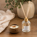 Coffret Duo solaire Luminante : bougie dans son contenant en noix de coco et diffuseur d'ambiance avec ses bâtonnets