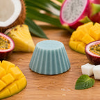 Fondant parfumé Luminante Fruits Exotiques entouré de mangue, d'ananas, de fruit du dragon et de noix de coco